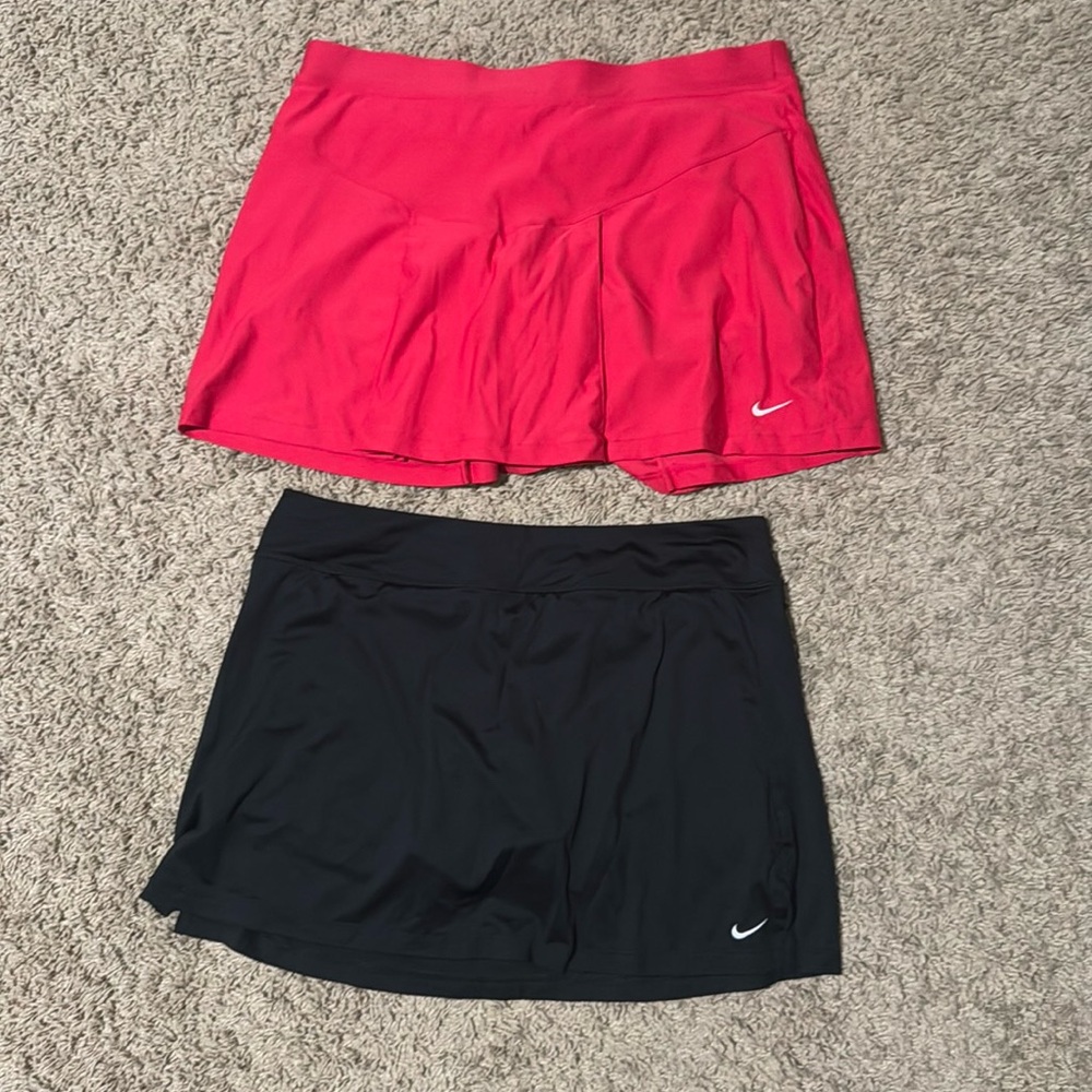 Size medium (fits like a true large) red Nike skirt, L black Nike skirt